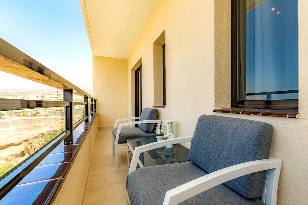 A seating area at Ferienwohnung Sea View Playa Paraiso