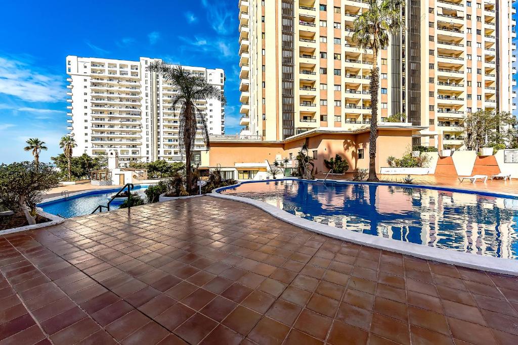 The swimming pool at or close to Ferienwohnung Sea View Playa Paraiso