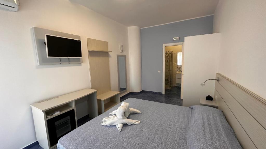TV a/nebo společenská místnost v ubytování Hotel La Giara