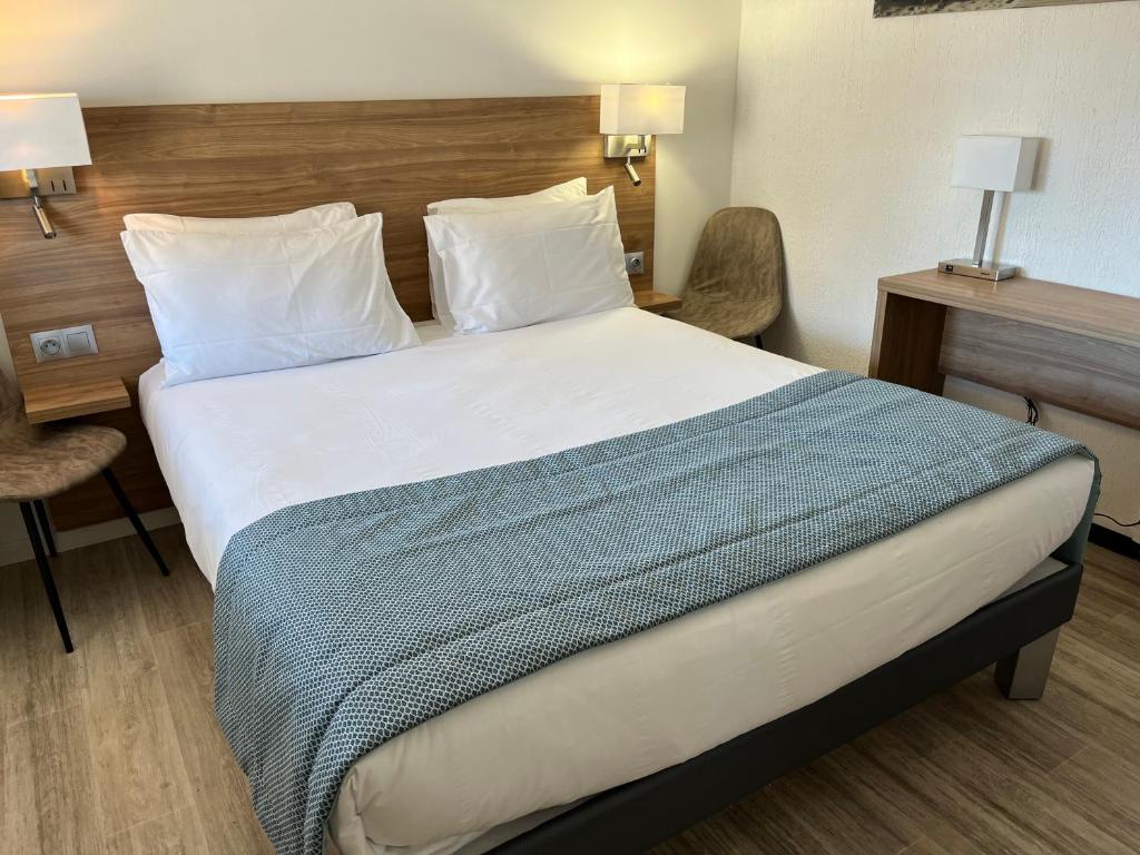 Postel nebo postele na pokoji v ubytování Hôtel Le Mirage