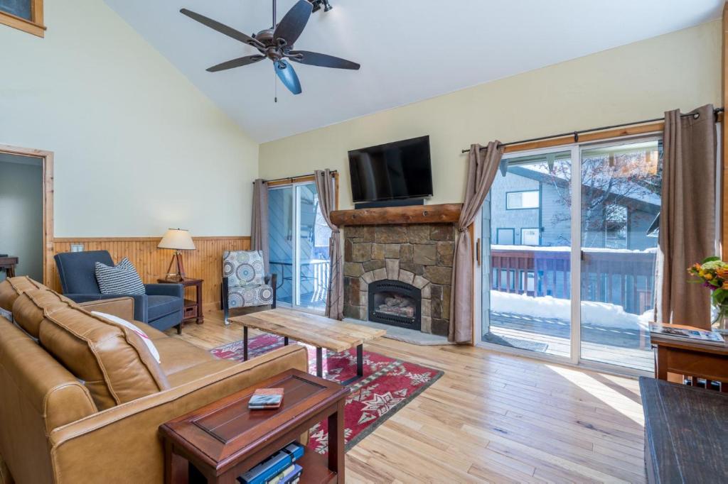 a living room with a couch and a fireplace at Krystal Villa #5 in Ketchum