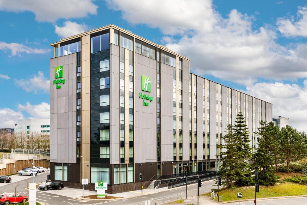 an office building with the name of the hotel at Holiday Inn Manchester Airport, an IHG Hotel in Hale