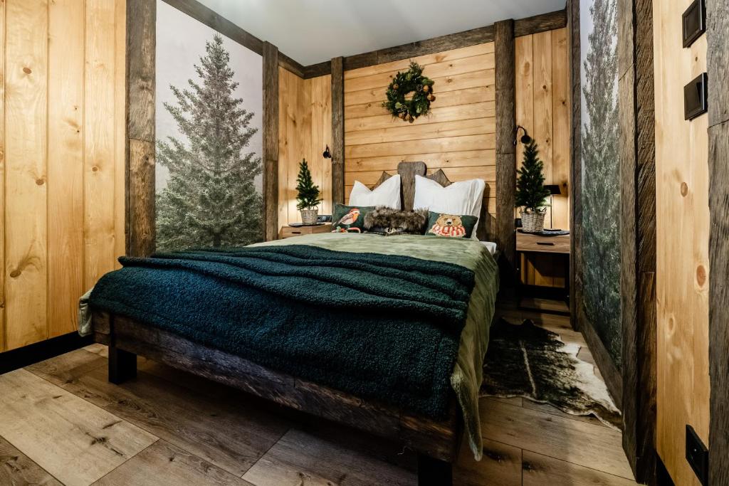 Postel nebo postele na pokoji v ubytování Brzozowa Osada - Premium Chalets Zakopane