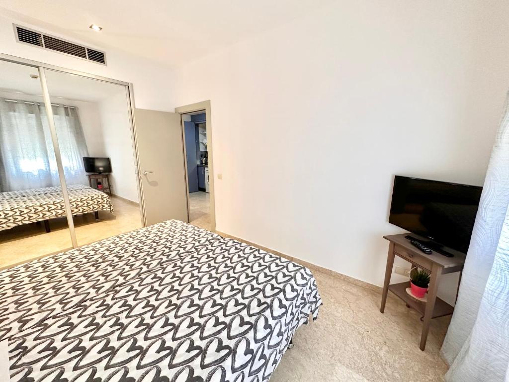 TV a/nebo společenská místnost v ubytování ApartHome®