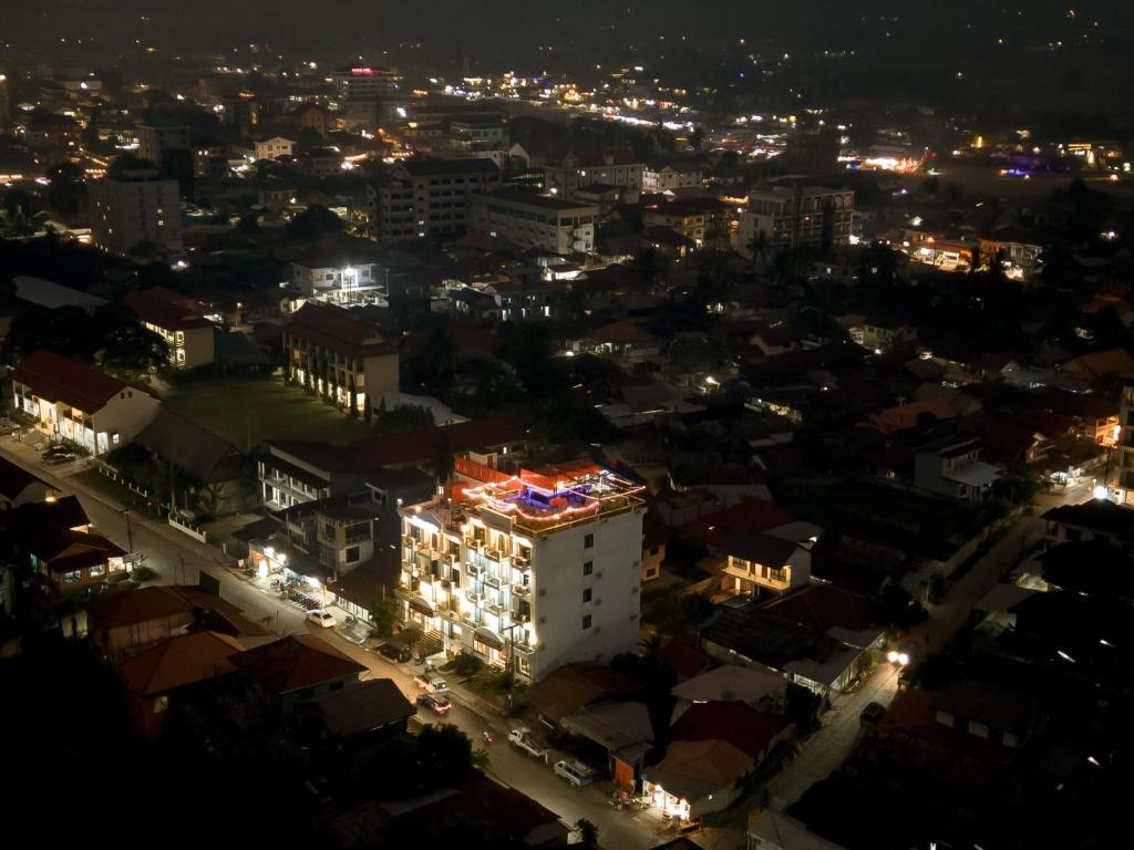 an aerial view of a city at night at Confetti Garden Hotel in Vang Vieng