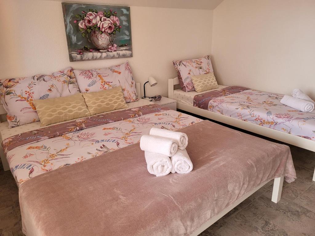 Postel nebo postele na pokoji v ubytování Rooms Sapina