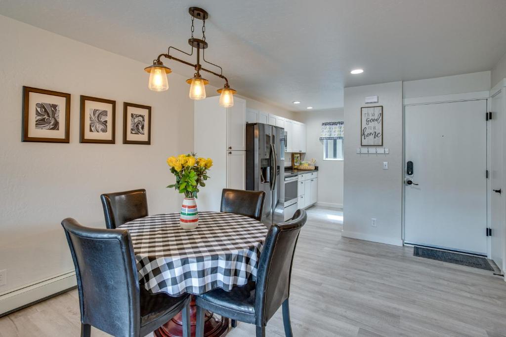 a kitchen and dining room with a table and chairs at Grand Junction Vacation Rental Indoor Pool Access in Grand Junction