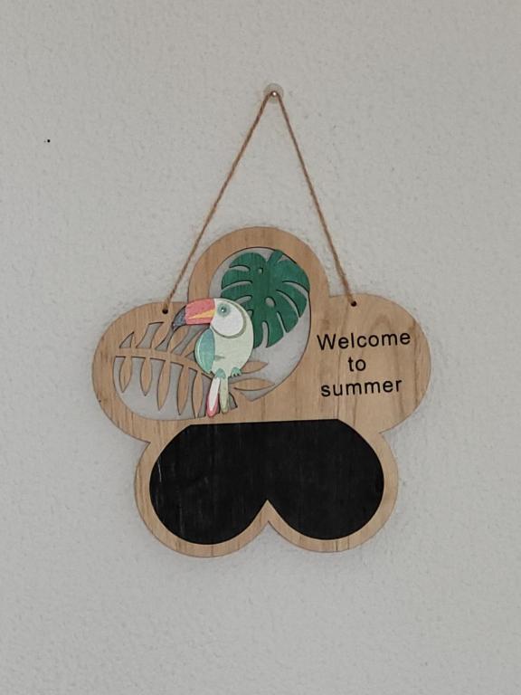 a welcome to summer sign with a moustache at Cozy Room near Metro & Airport in Lisbon
