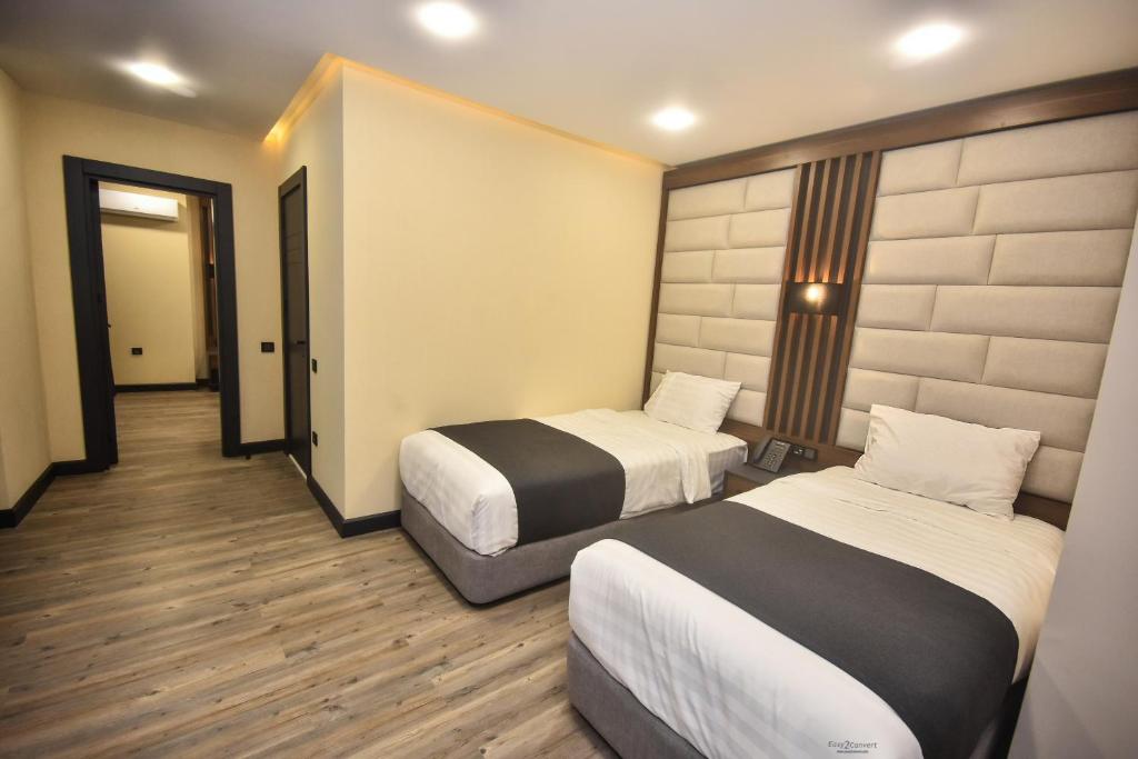 Postel nebo postele na pokoji v ubytování Batumi View Luxury
