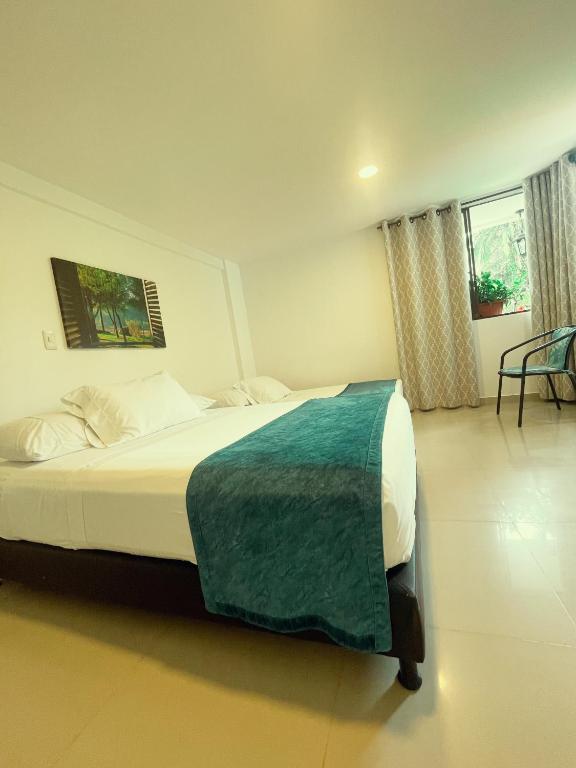 Postel nebo postele na pokoji v ubytování Hotel Campestre Villa Mary
