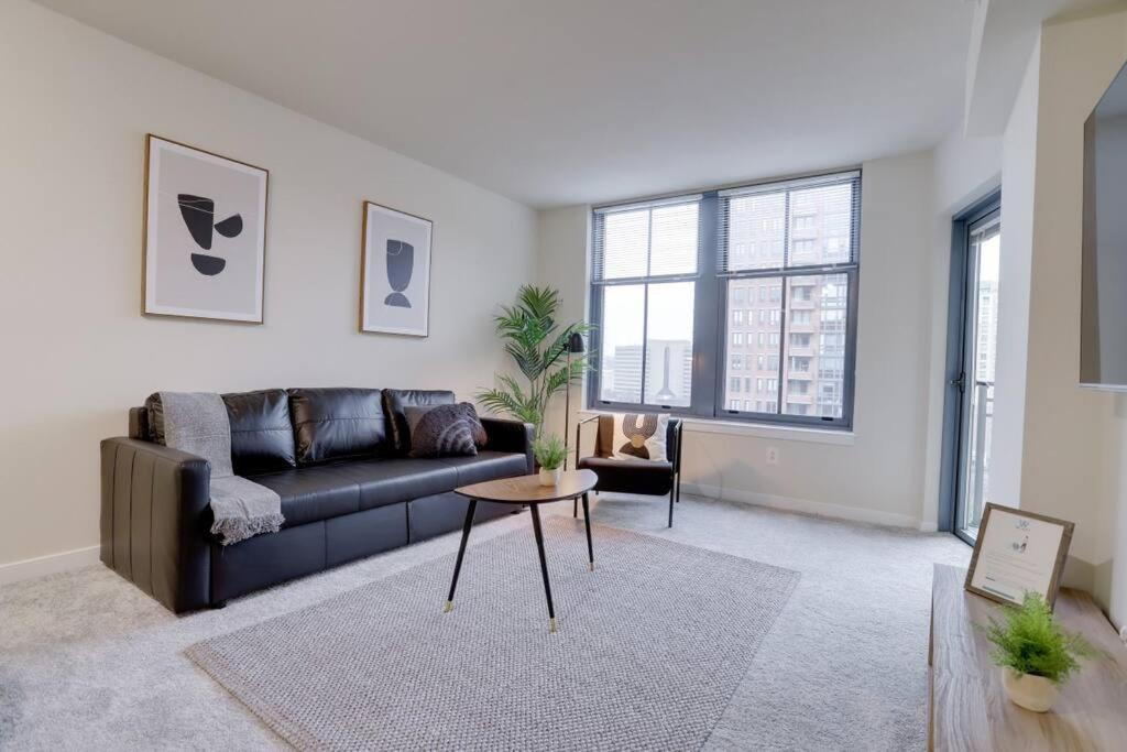 a living room with a couch and a table at Beautiful 1BR Apt At Pentagon City with Great View in Arlington