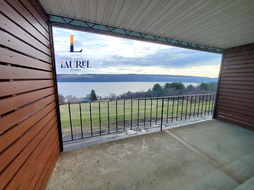 a large window in a garage with a view of a lake at The Hotel Laurel at Seneca in Watkins Glen