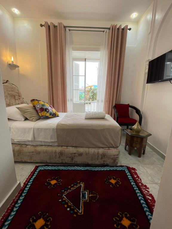 Ένα ή περισσότερα κρεβάτια σε δωμάτιο στο Hotel Palace tanger