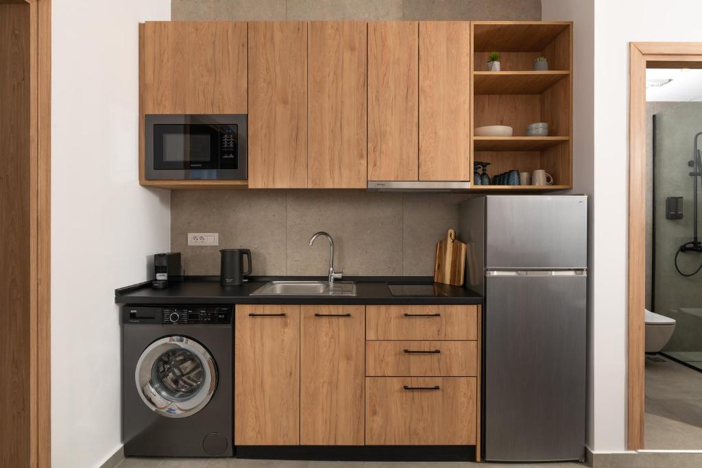 Kuchyň nebo kuchyňský kout v ubytování Venthos Apartments