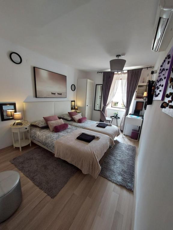 Posteľ alebo postele v izbe v ubytovaní Apartment Agora