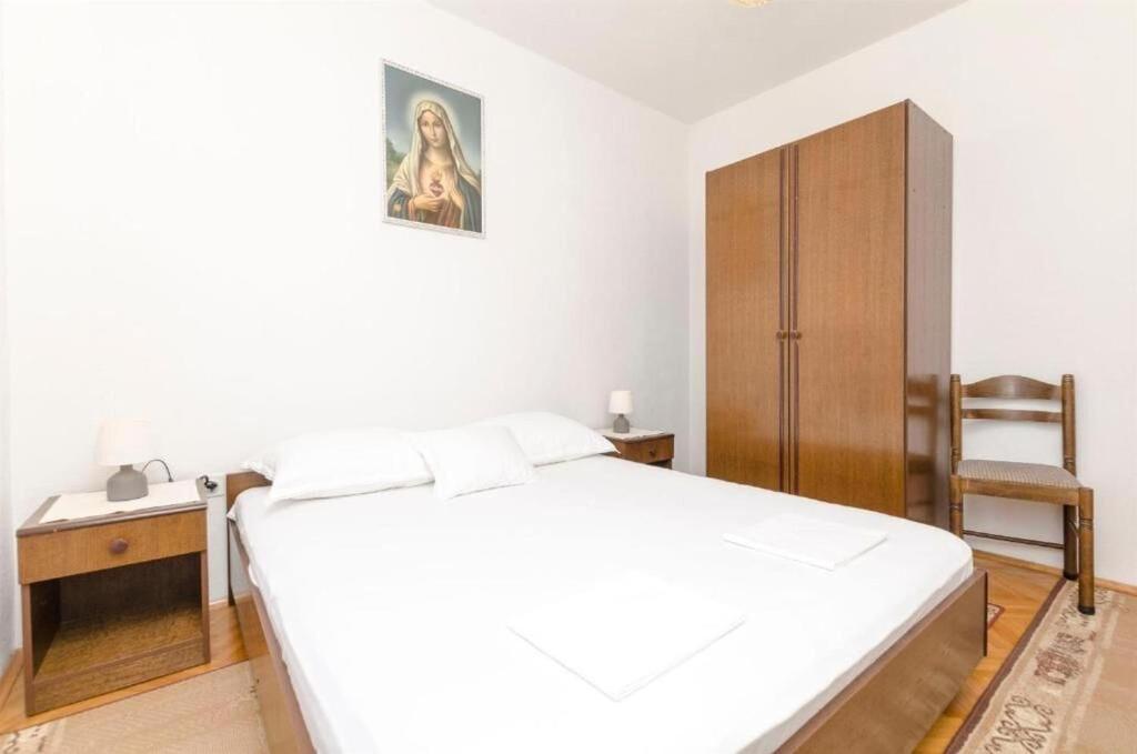 Posteľ alebo postele v izbe v ubytovaní Apartments Spavalo