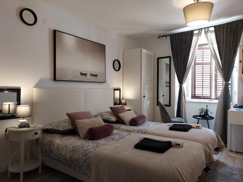 Posteľ alebo postele v izbe v ubytovaní Apartment Agora