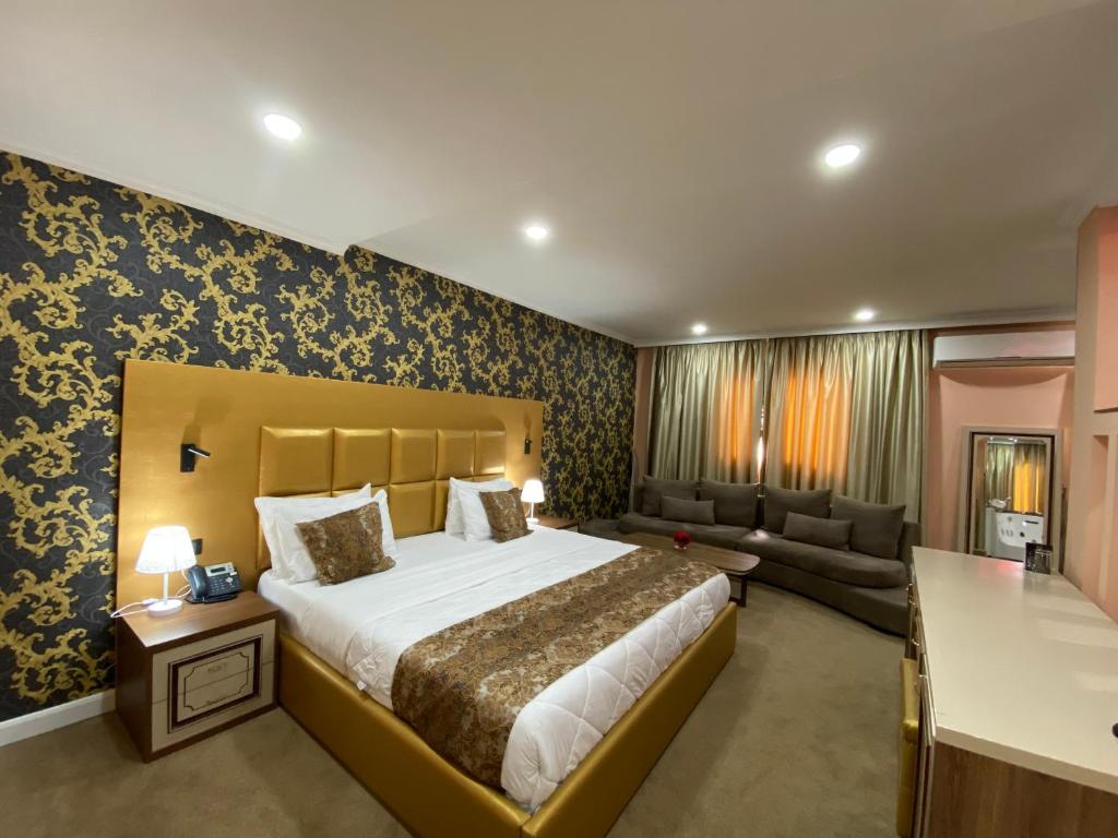 Postel nebo postele na pokoji v ubytování Hotel Deluxe