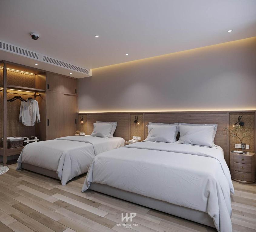 Postel nebo postele na pokoji v ubytování Mai An Hotel