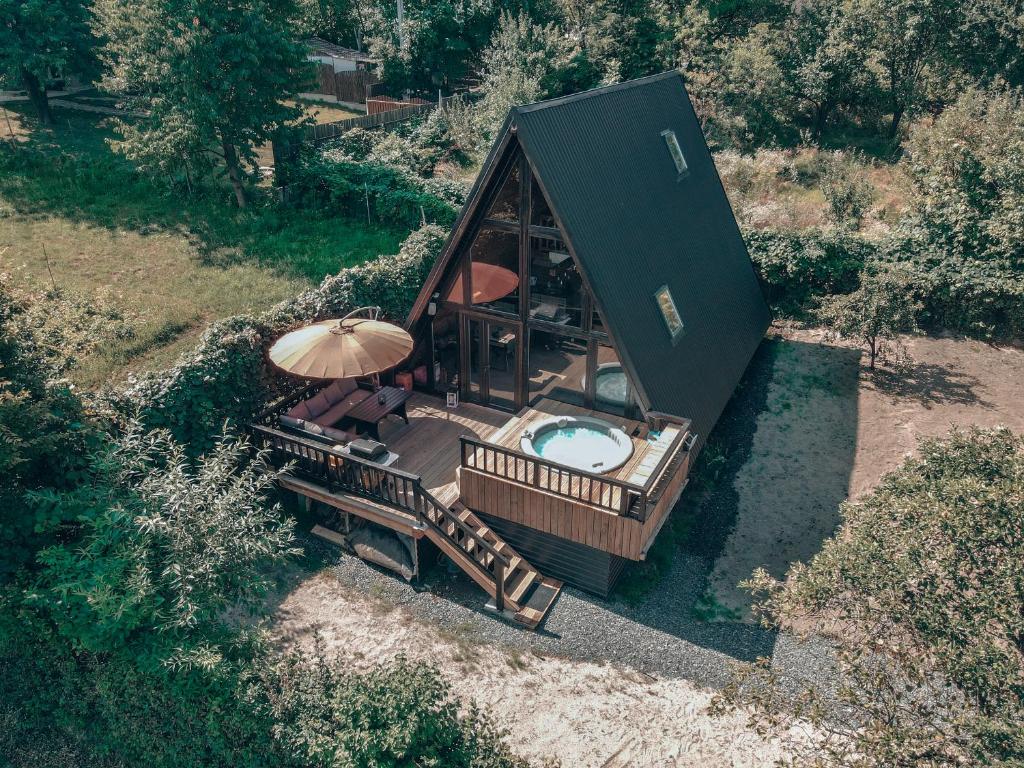 an overhead view of a small house with a hot tub at Valdo Cabin in Sadu