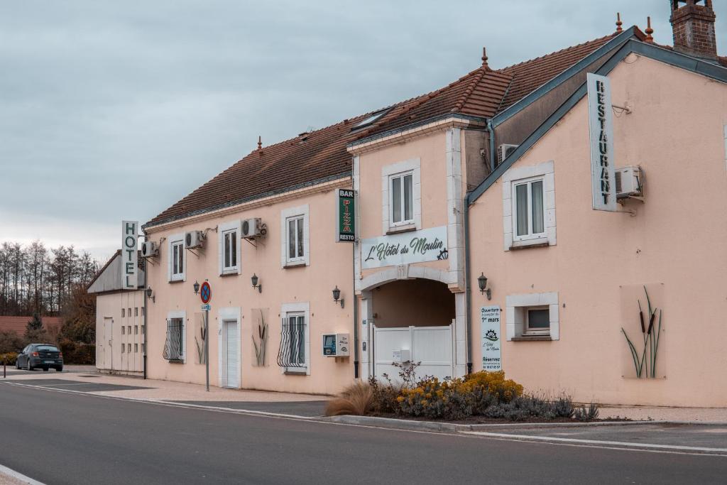 a building on the side of a street at HOTEL DU MOULIN in Voué