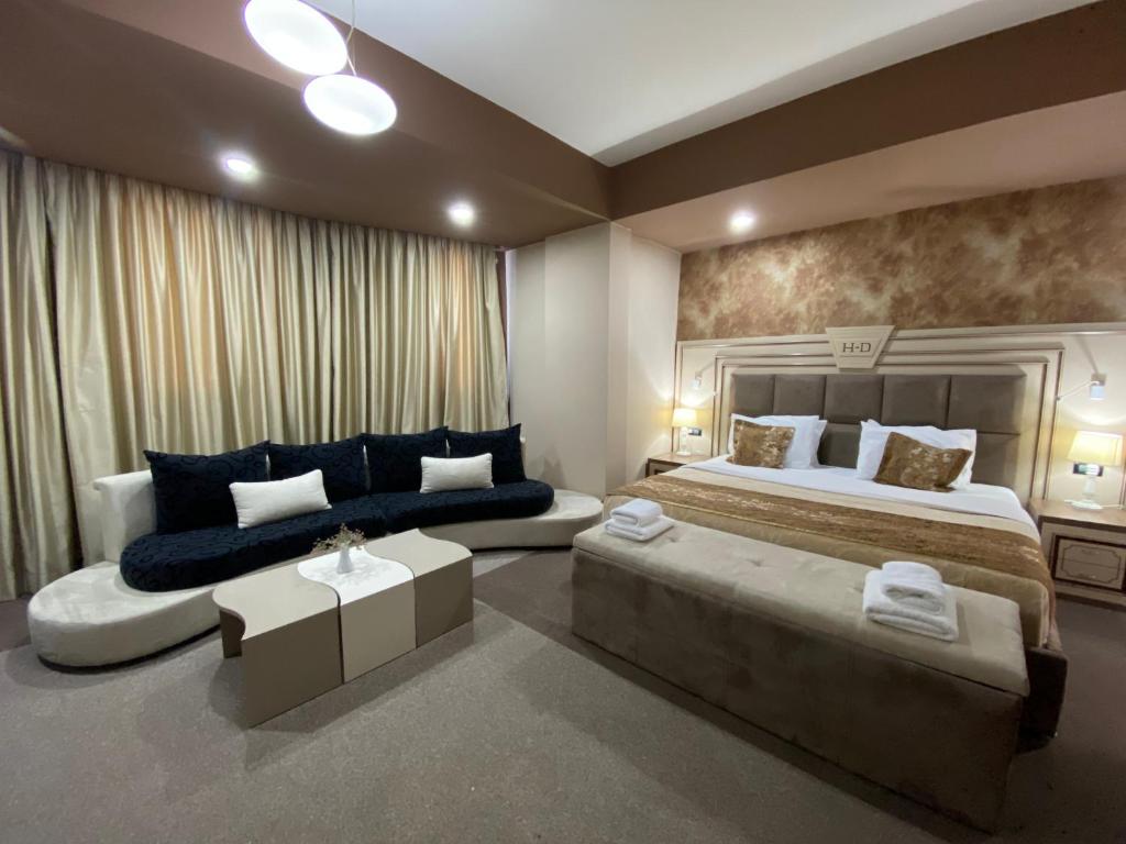 Postel nebo postele na pokoji v ubytování Hotel Deluxe