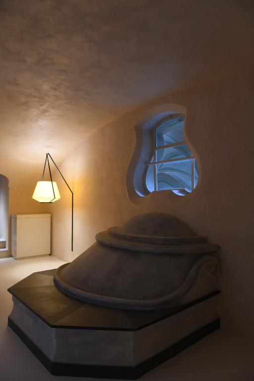 Postel nebo postele na pokoji v ubytování Hotel Palazzo Durazzo Suites