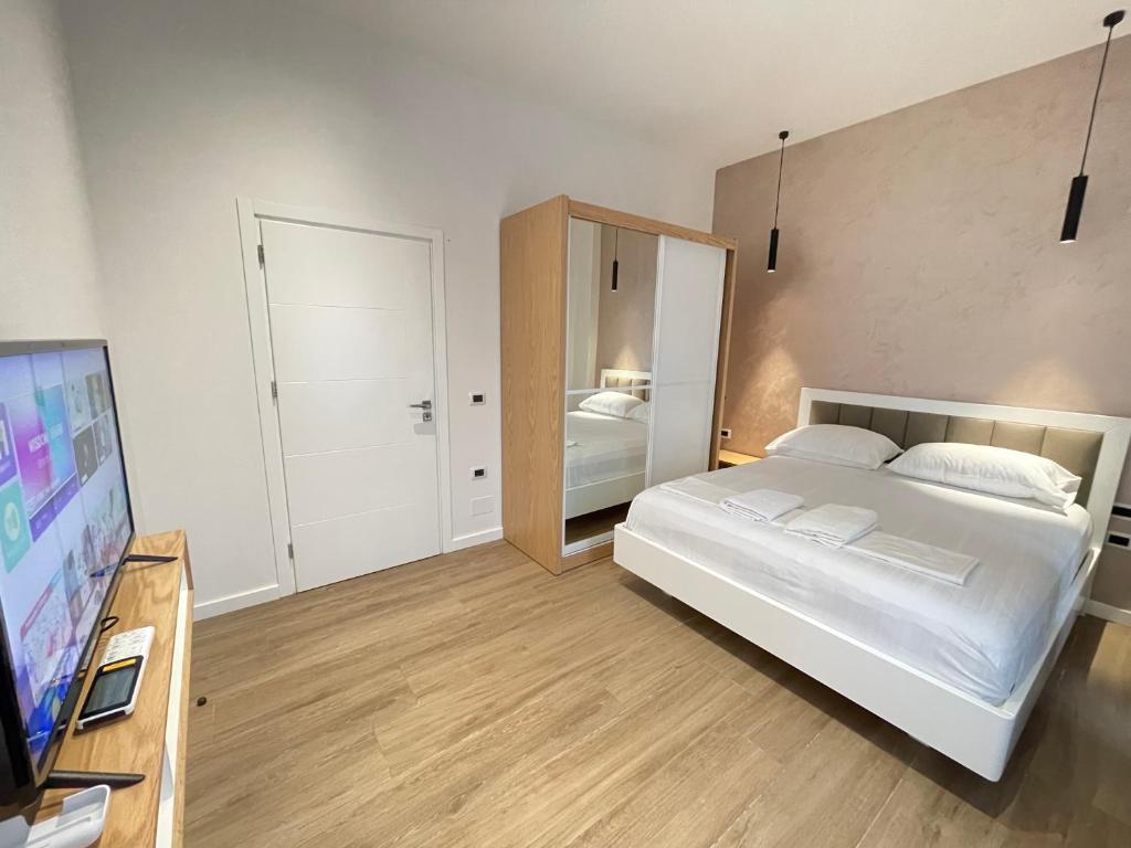 Postel nebo postele na pokoji v ubytování Arial Trinity Suites