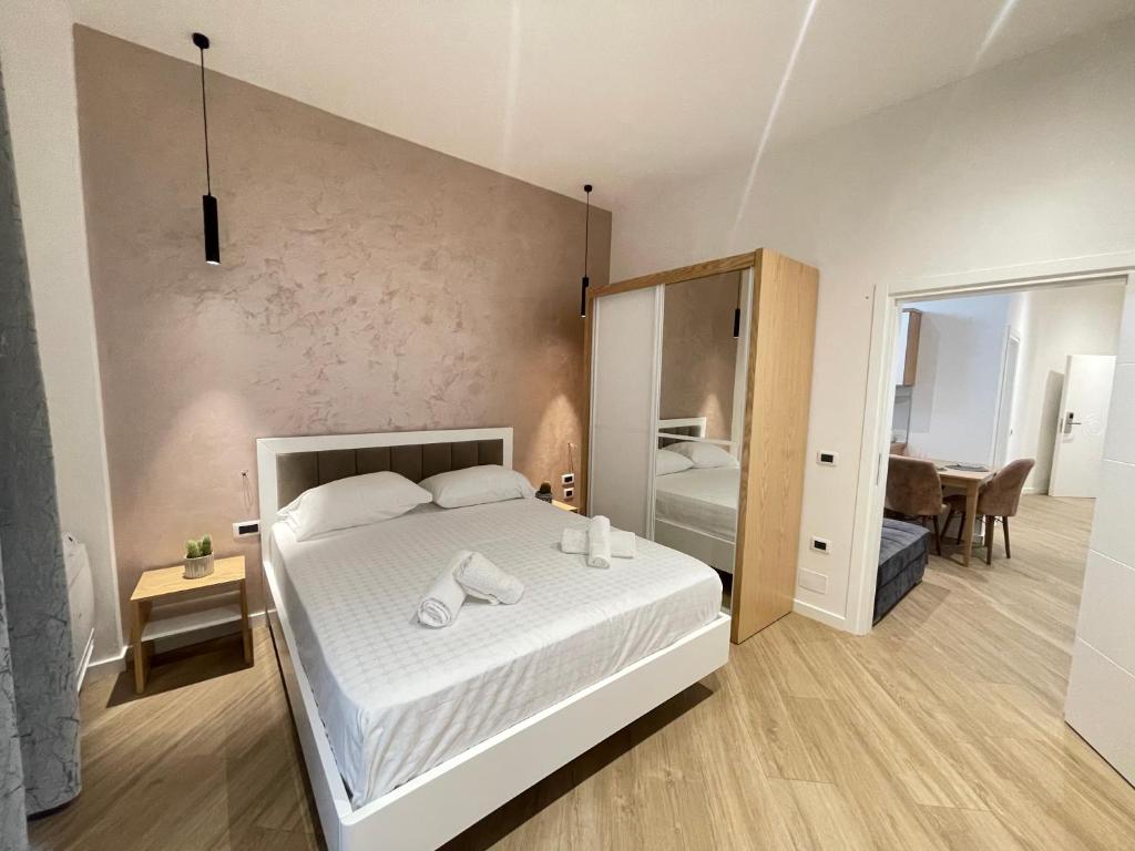 Postel nebo postele na pokoji v ubytování Arial Trinity Suites