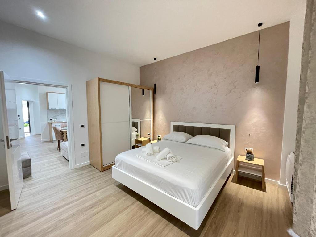 Postel nebo postele na pokoji v ubytování Arial Trinity Suites