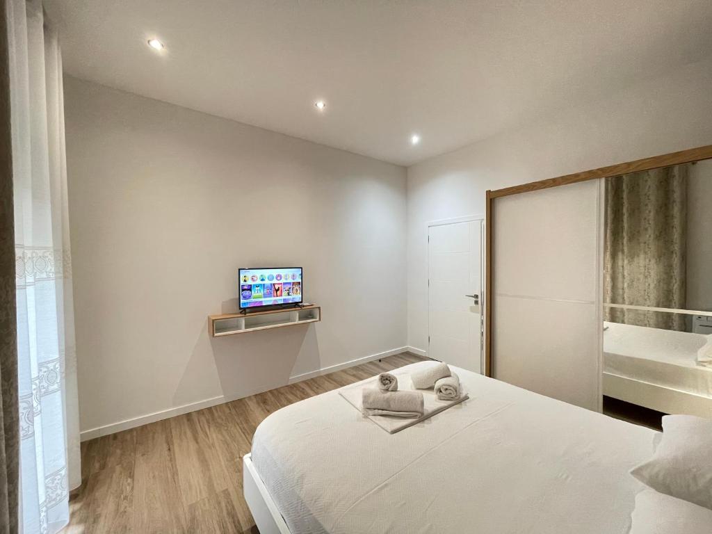 Postel nebo postele na pokoji v ubytování Arial Trinity Suites