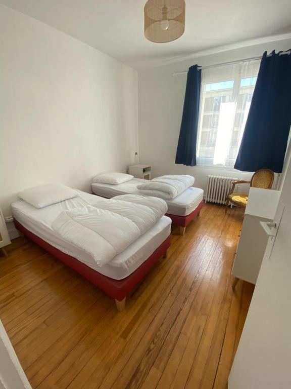 Posteľ alebo postele v izbe v ubytovaní Le Petit Paris
