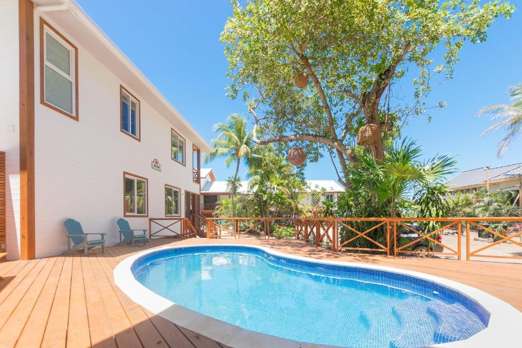 a swimming pool in the backyard of a house at Casa Coral home in Roatan