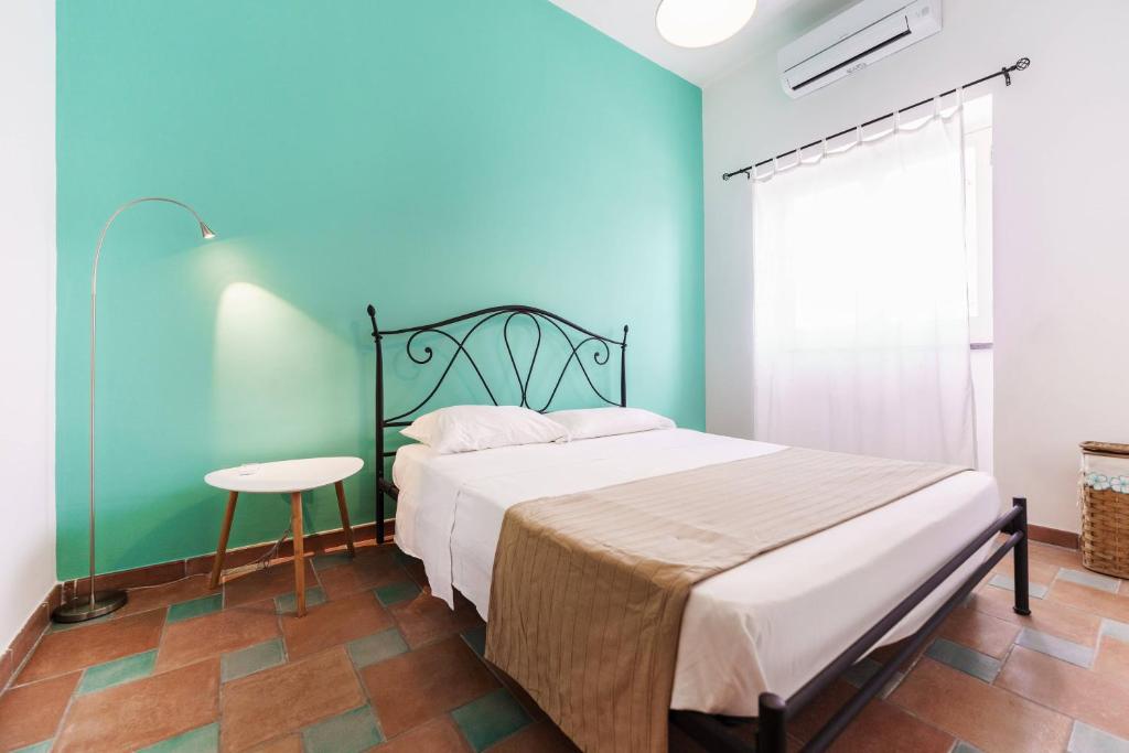 Postel nebo postele na pokoji v ubytování Le Grand Bleu - Gioia Apartments