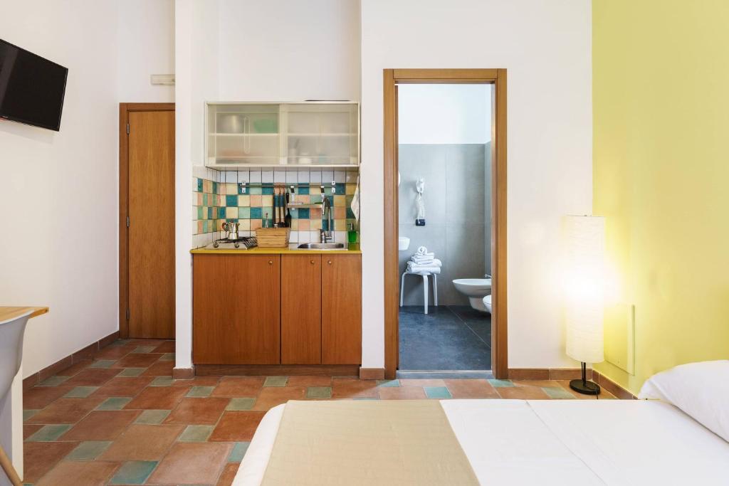 Postel nebo postele na pokoji v ubytování Le Grand Bleu - Gioia Apartments
