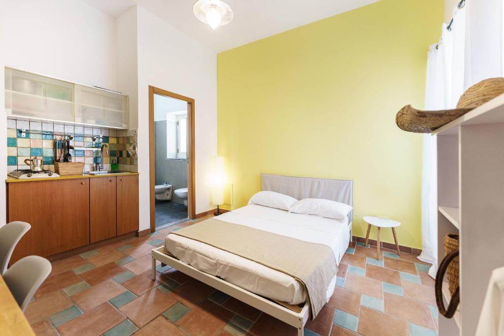 Postel nebo postele na pokoji v ubytování Le Grand Bleu - Gioia Apartments