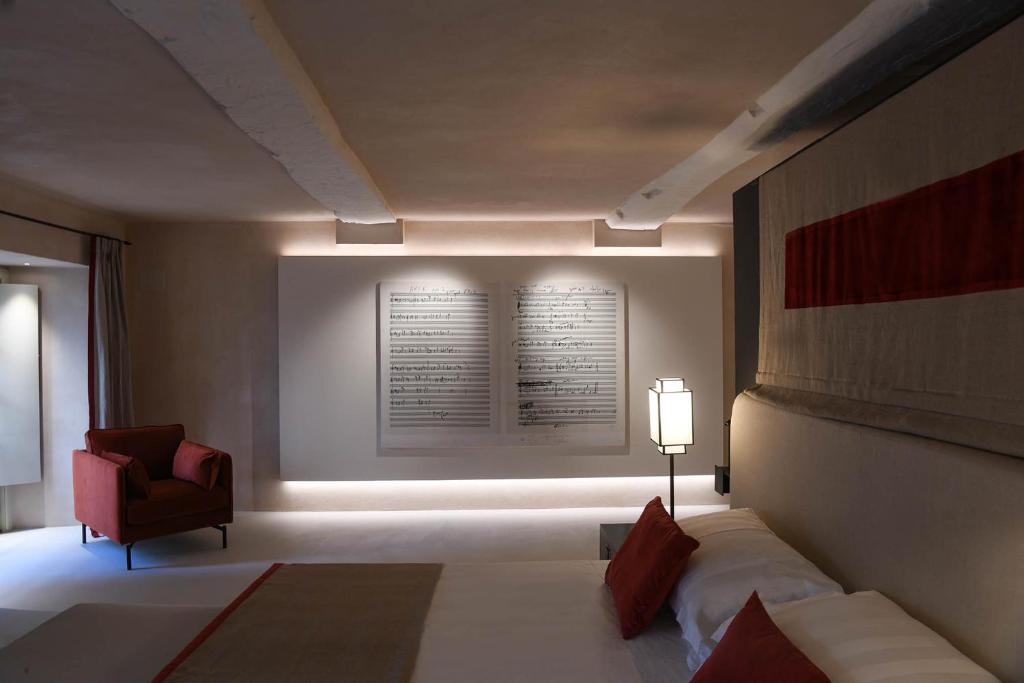 Postel nebo postele na pokoji v ubytování Hotel Palazzo Durazzo Suites