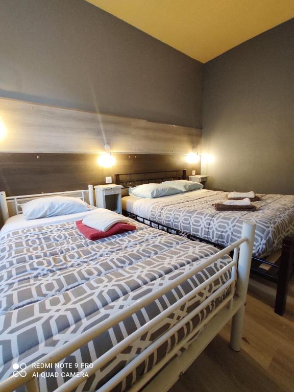 Postel nebo postele na pokoji v ubytování Hotel Le Bon Moine