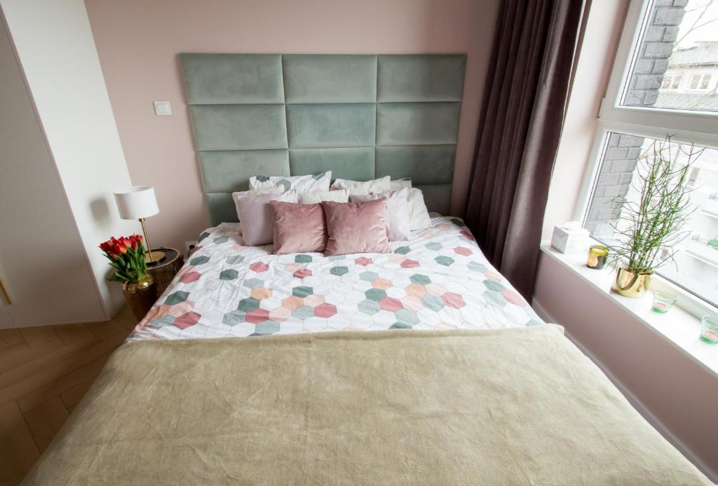Posteľ alebo postele v izbe v ubytovaní Nowy Apartment przy Placu Szembeka