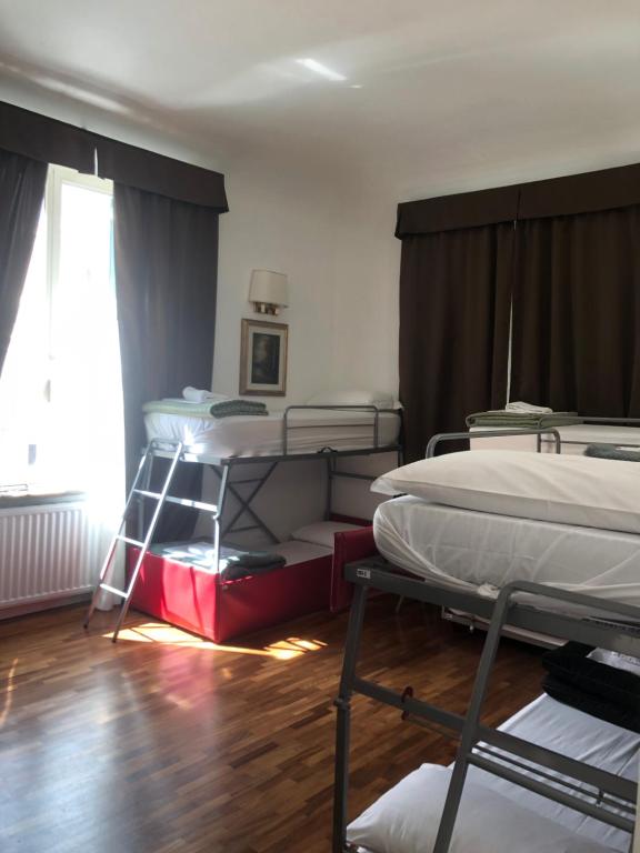 a room with two bunk beds and a window at Grand Cucinetta in Rome