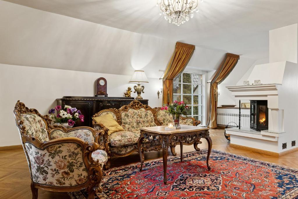 a living room with a couch and a table at Villa Muusa in Tallinn