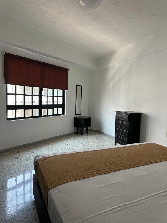 Postel nebo postele na pokoji v ubytování Múcara hotel