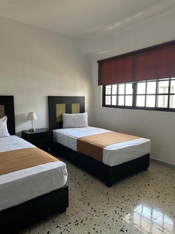 Postel nebo postele na pokoji v ubytování Múcara hotel