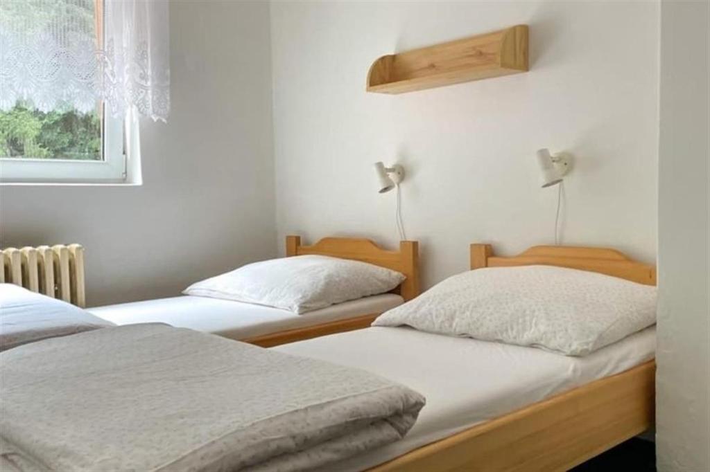 Postel nebo postele na pokoji v ubytování Chata Čeňkovka