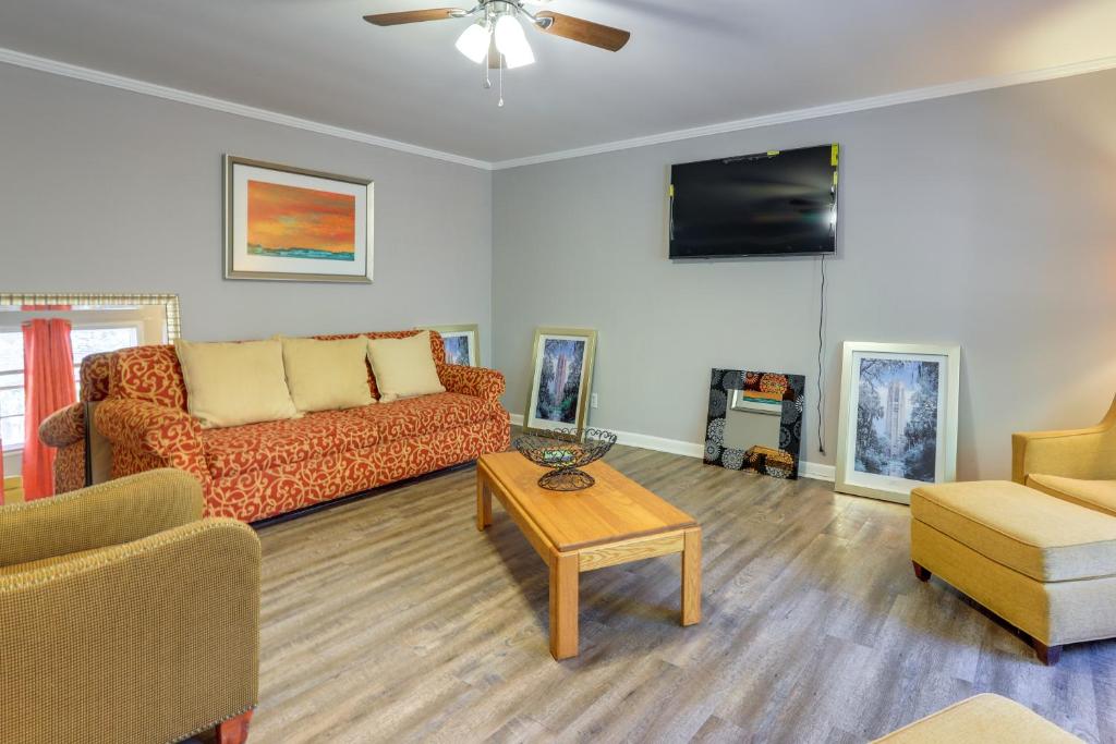 a living room with a couch and a table at Cozy and Convenient Macon Home about 3 Mi to Town! in Macon