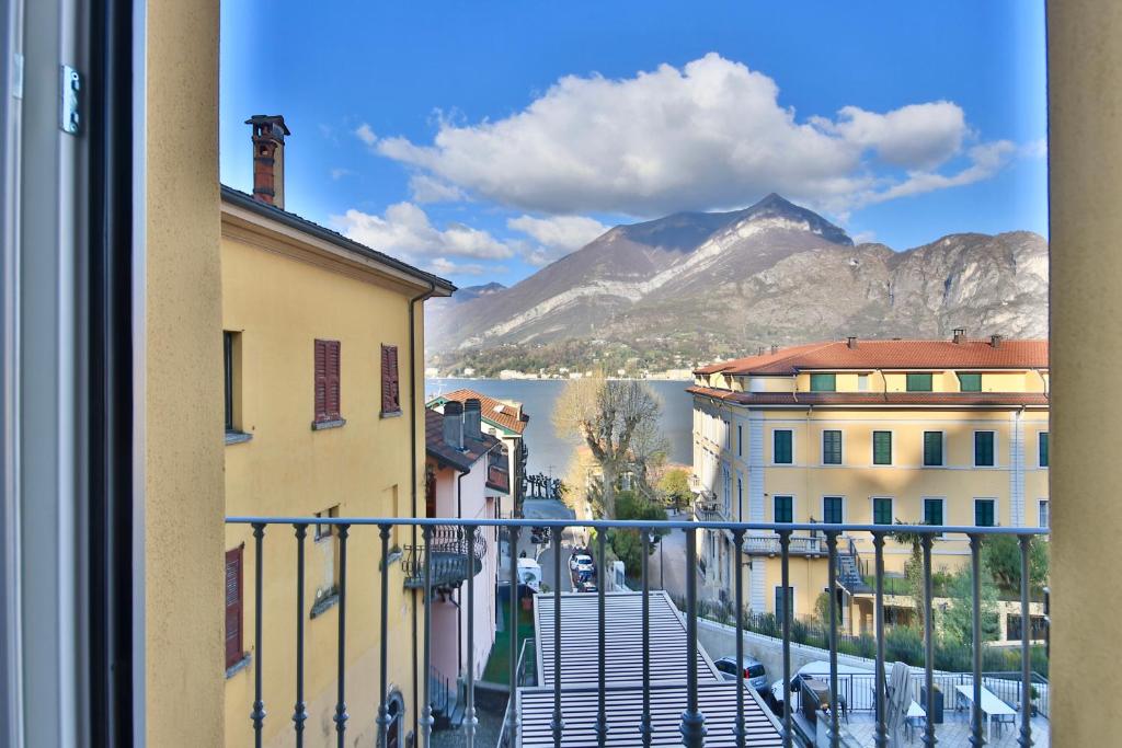 a view from a balcony of a city with mountains at Renzo Bellagio by KlabHouse in Bellagio
