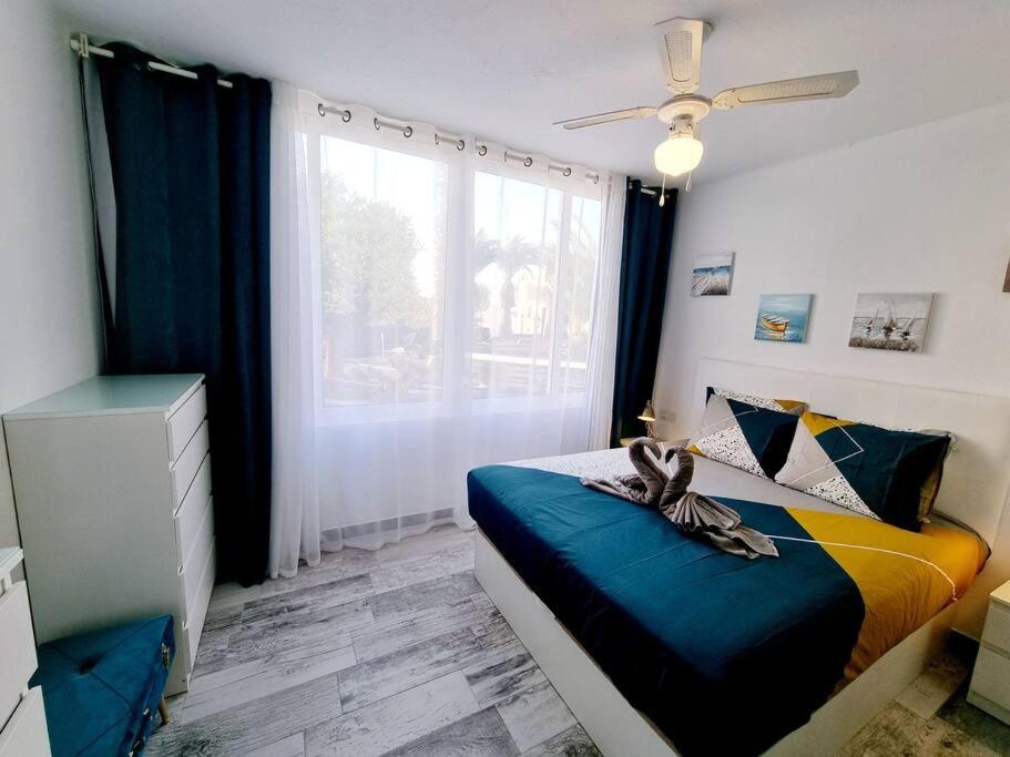 Postel nebo postele na pokoji v ubytování Apartamento SMERALDO 11 PLAYA ROCA