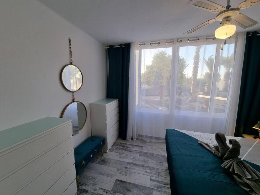 Postel nebo postele na pokoji v ubytování Apartamento SMERALDO 11 PLAYA ROCA