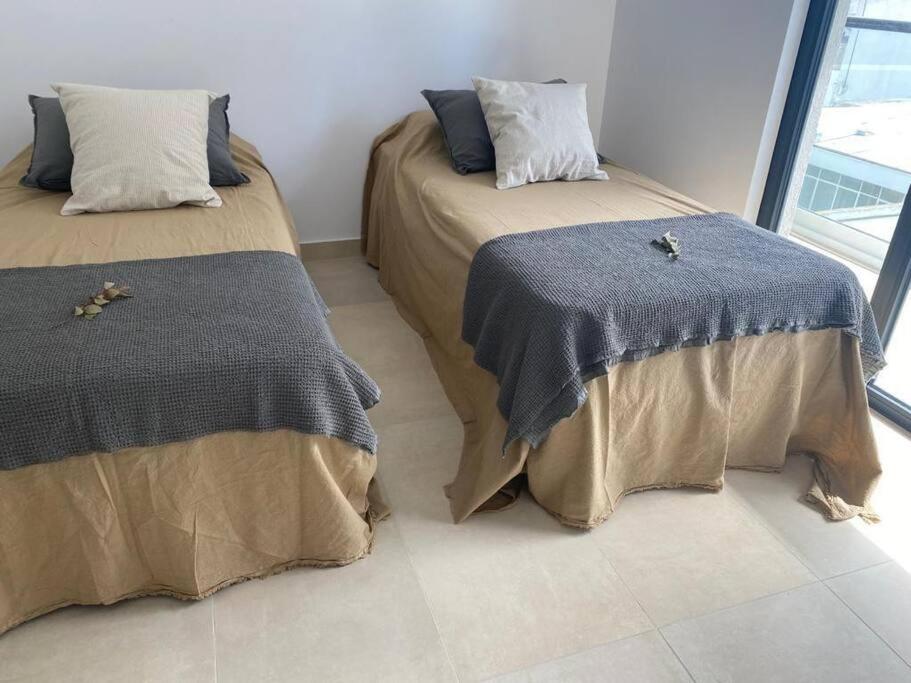 Een bed of bedden in een kamer bij Departamento Maipú Bastión