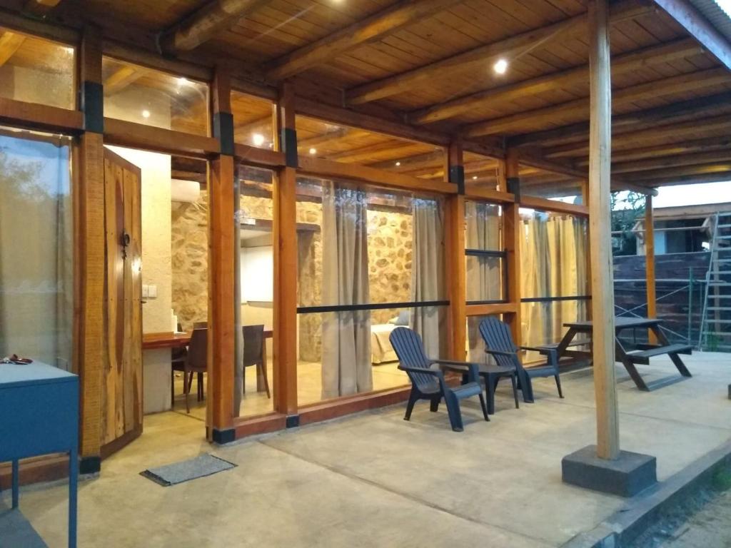 a house under construction with chairs and a table at La Comarca Loft in San Javier